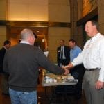 Networking abounds, complete with the tried and true handshake and exchange of business cards.