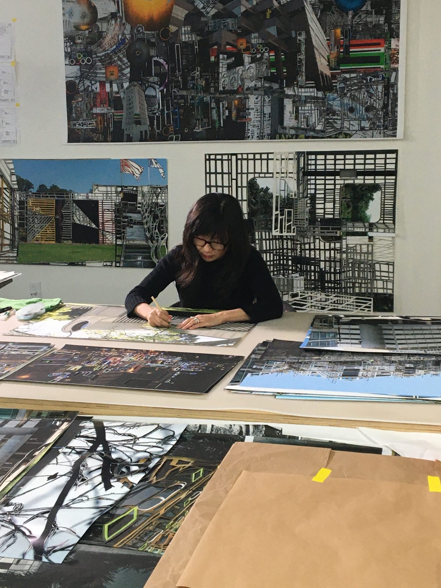 Soo Kim in her studio working on Night / Quartz, her artwork design for Wilshire/La Cienega Station platform (in progress)