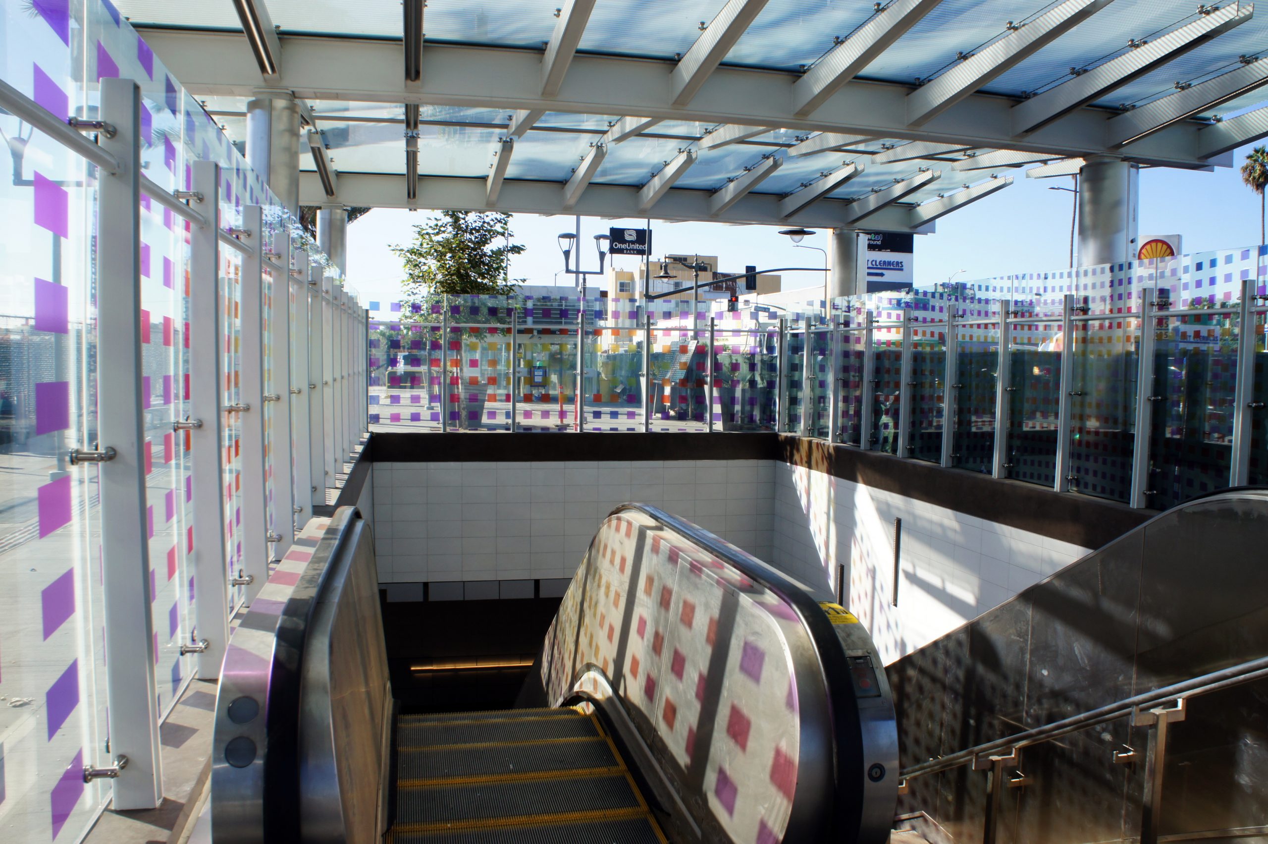 Caption: The vibrant patter of color cast throughout the station entrance is inspired by neighboring West Angeles Cathedral 