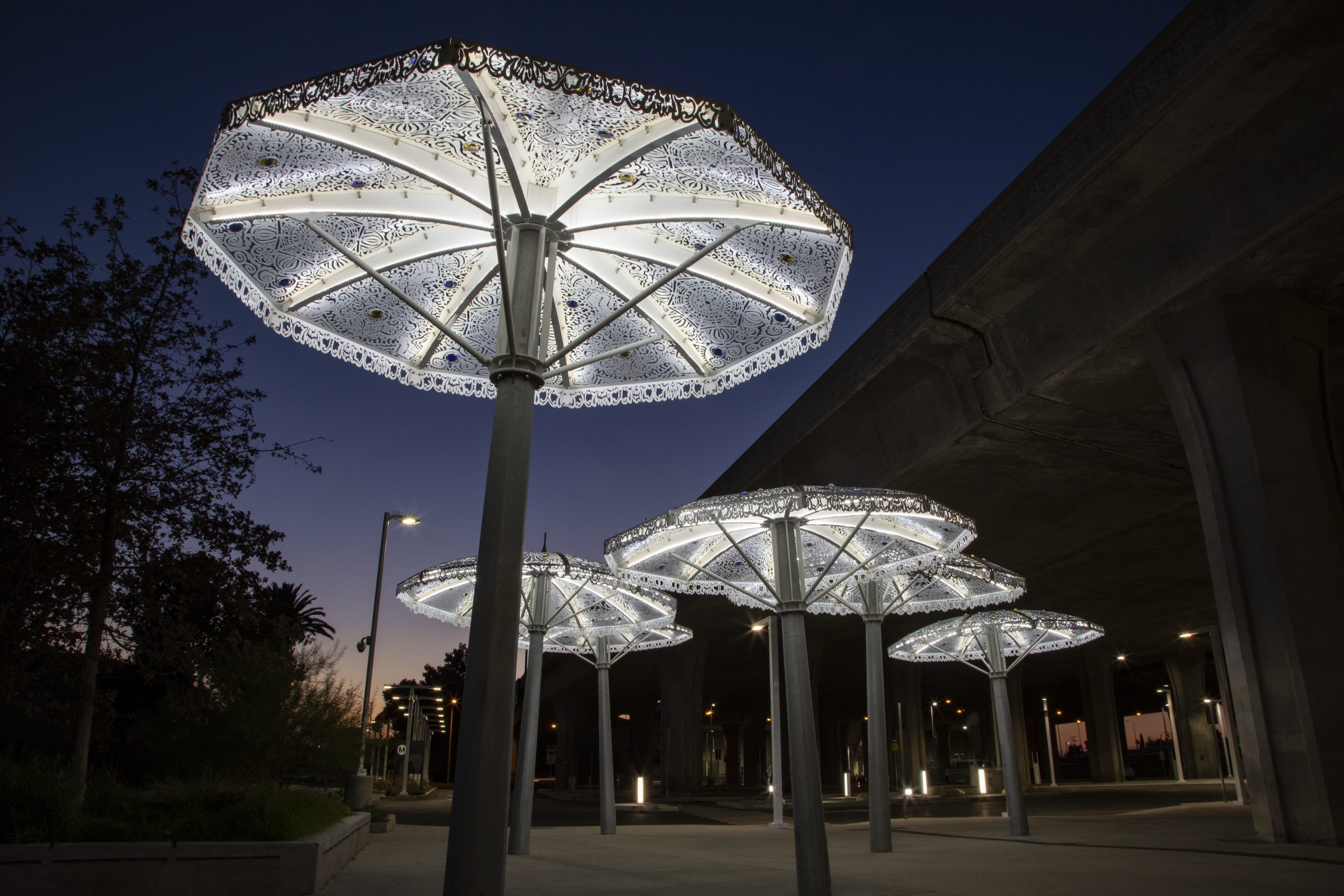 Custom LED lights built into the artworks turn on nightly to illuminate the station pathways with a dreamy and luminescent glow. 