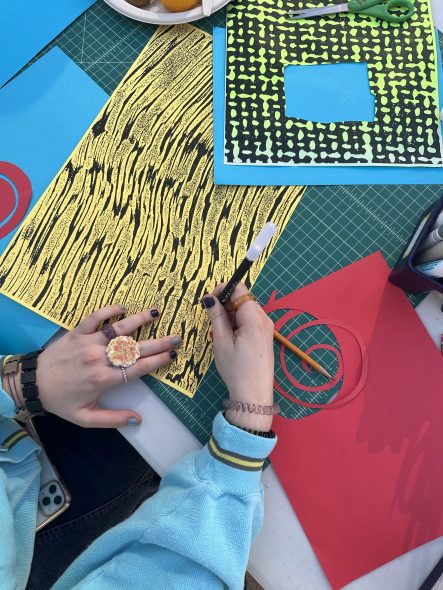 Students used color paper, markers, scissors and glue to create their Prismatic Self-Portraits.